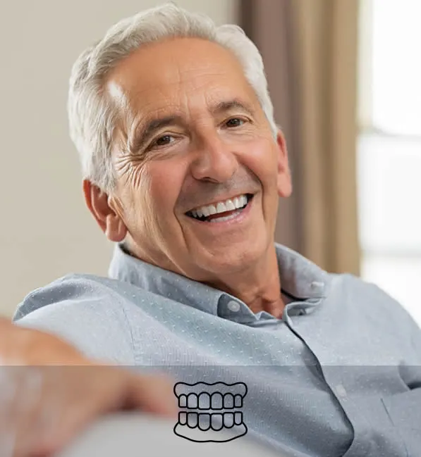 older man smiling with dentures
